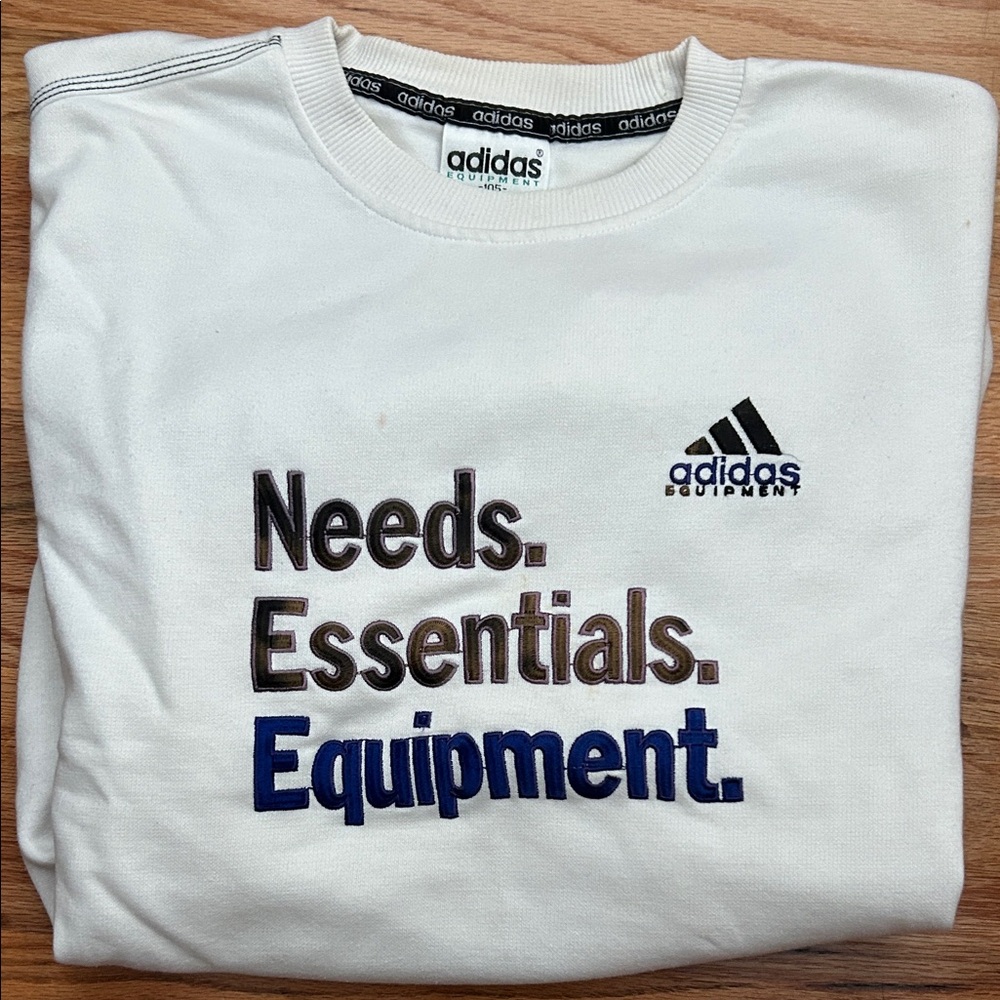 Adidas Needs. essentials. Equipment. Crewneck